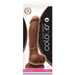 Packaging for the Colours Long 9.5 Inch Dual Density Medium Tone Silicone Dildo with Balls features a realistic platinum-grade silicone toy in brown, suction base, strap-on compatibility, actual size image, and clear brand details.