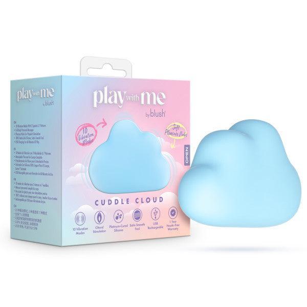 The Cuddle Cloud External Palm Sized Vibrator in blue sits by its white and pastel "play with me by blush" packaging, which highlights vibration modes and a splashproof, body-safe silicone design.