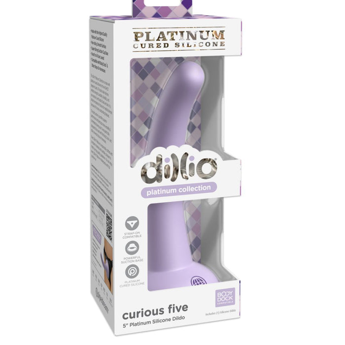 A product box displays the Curious Tapered Beginner & Pegging 5 Inch Tapered Purple Silicone Dildo, labeled body-safe with a suction cup base, partially visible through a clear packaging window.