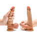 Two hands hold the DaVinci Ultra Realistic Long 8 Inch Silicone Dildo with Sliding Foreskin, displayed upright against a white background. This lifelike dildo features a suction cup base and flesh-toned detailing for realism.