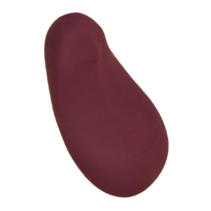 The Dame Pom Hand Held Flexible Vibrator in Plum is a waterproof, pebble-shaped sex toy made from medical grade silicone, featuring a smooth surface and subtle raised button, shown isolated on a white background.