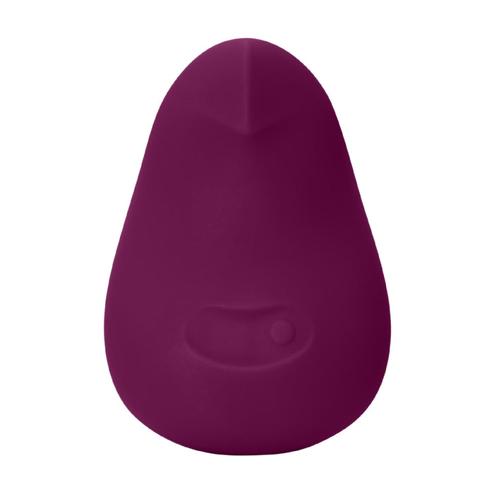 The Dame Pom Hand Held Flexible Vibrator in Plum is a small, pear-shaped device made from medical grade silicone, featuring a smooth surface and a single indented front button, shown against a white background.