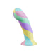 The Daydream Smooth Slim Silicone Dildo with Suction Cup, in pastel yellow, purple, blue, and pink with a twisted design, stands upright on a white background—artisanal and perfect for internal stimulation.