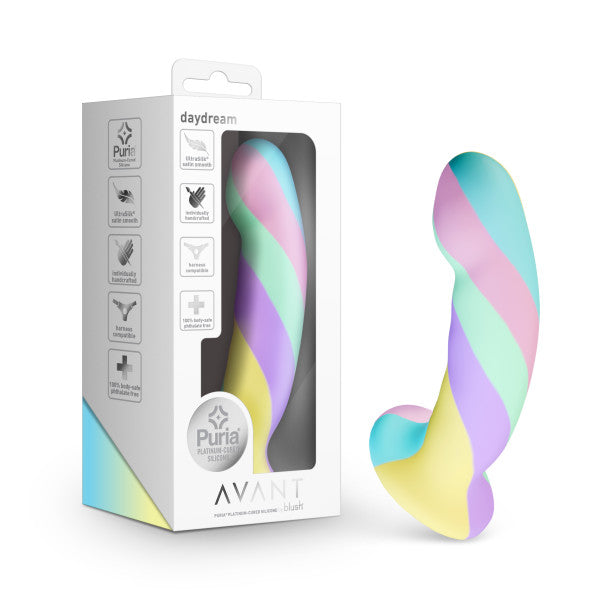 The Daydream Smooth Slim Silicone Dildo with Suction Cup is shown next to its box, featuring swirled pastel pink, blue, green, and yellow stripes and a curved shape for internal stimulation. The packaging displays product features and the Avant brand.
