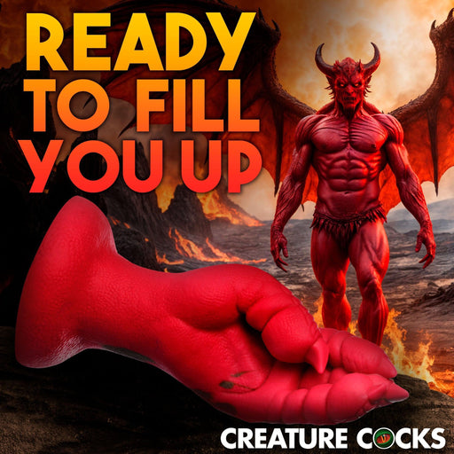 A muscular red demon with wings stands on volcanic terrain. In front is the Demon Claw Long Thick Fantasy Fisting Silicone Dildo. Bold yellow and orange text reads, "Ready to fill you up." Creature Cocks logo appears at the bottom.