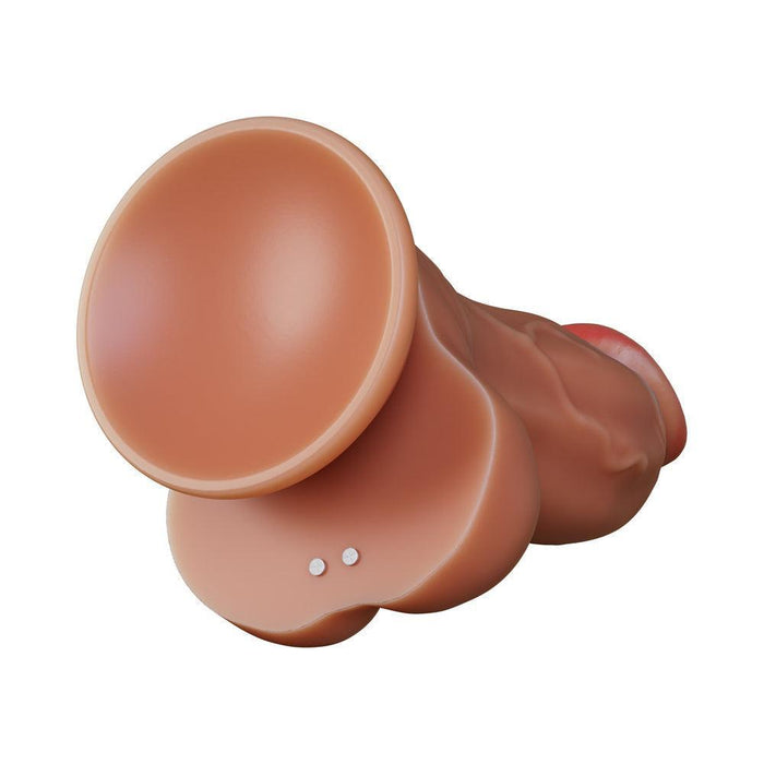 The Dr Brody Long Thick Thrusting 8.75 Inch Vibrating Silicone Dildo is flesh-toned with a suction cup base, two metal studs near the base, and is harness compatible. Shown against a white background for versatile play.