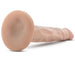 The Dr. Skin 5 Inch Mini Light Tone Dildo, a thin beginner-friendly silicone suction cup dildo with a realistic look and veined texture, is displayed on a white surface.