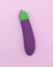 Eggplant Emojibator Vibrator upright on purple background 