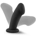 The Elvira Short Thick Smooth 6 Inch Suction Cup Dildo in Black Silicone features a curved, flexible shaft for internal stimulation, a flared base for safety, and is shown upright with shadowed outlines to display its adjustable angles.