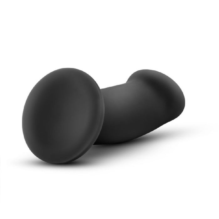 The Elvira Short Thick Smooth 6 Inch Suction Cup Dildo in black silicone, featuring a flared base and flexible shaft, is shown lying on a white background.