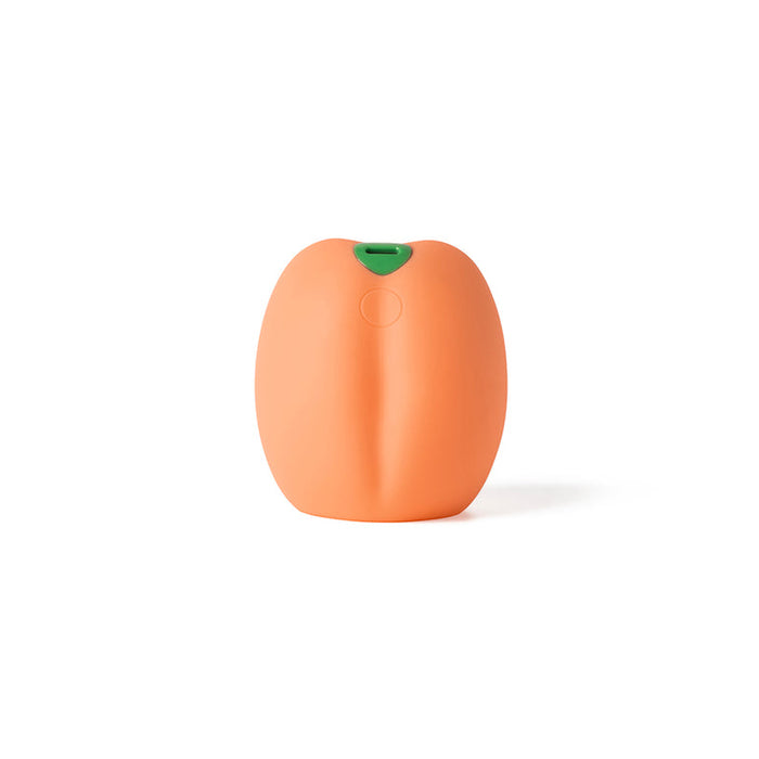 The Emojibator Peach Vibrating Penis Stroker is an orange, oval silicone toy with a subtle seam and small green opening—waterproof and ideal for pleasure—shown against a plain white background.