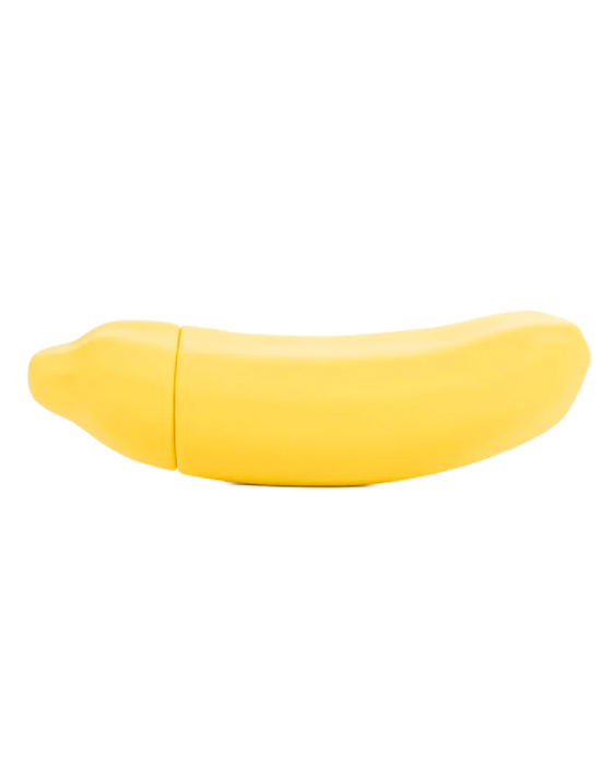 A bright yellow Banana Emojibator Vibrator by Dame Products isolated on a white background.
