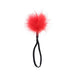 A fluffy red pom-pom on a black elastic loop, from the Ex's & Oh's Kiss Kit - 4 Piece Beginner Bondage Kit, displayed against a white background.
