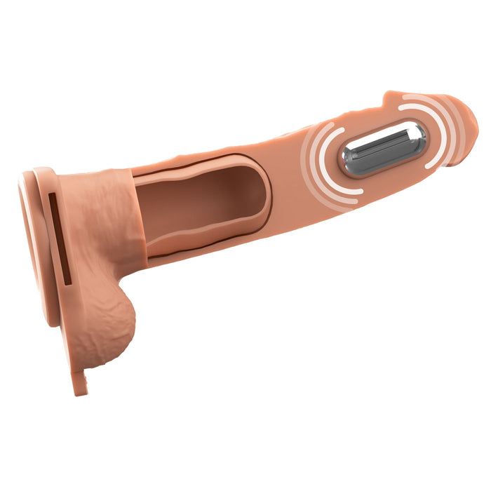 A cross-section illustration of the Fantasy X-Tensions Elite Vibrating Hollow 7 Inch Silicone Dildo & Strap-On Harness - Vanilla, showing anatomical detailing, an open inner chamber, and a vibrating component with wavy lines indicating vibration.