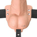 The Fantasy X-Tensions Elite Vibrating Hollow 7 Inch Silicone Dildo & Strap-On Harness - Vanilla features a lifelike, vanilla-toned silicone dildo with textured detail and adjustable black straps adorned with metal rivets.