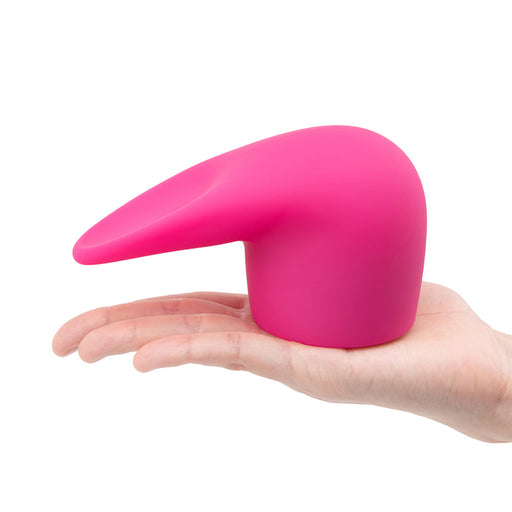 A hand holds the Flick Oral Sex Simulating Flexible Silicone Wand Attachment—a bright pink, smooth, curved accessory ideal for clitoral stimulation—against a white background.