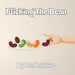 A hand flicks a red kidney bean among colorful beans on a plate. The cover reads "Flicking The Bean Adult Humor Book by Jen Jenivive"—a cheeky, playful read that's perfect as an adult-themed gift.