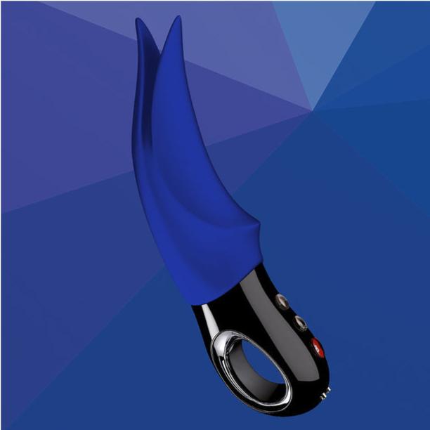 The Fun Factory Volta Rechargeable External Vibrator in Petrol Blue is a petal-shaped personal massager designed for external stimulation. It has a black handle, round control buttons, and is body-safe for comfortable and effective use against a geometric blue background.