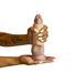A person with light green nails and a floral tattoo holds the Girth Enhancing Silicone Penis Sleeve – 25% Increase, a soft, realistic sleeve designed to add girth, against a white background.