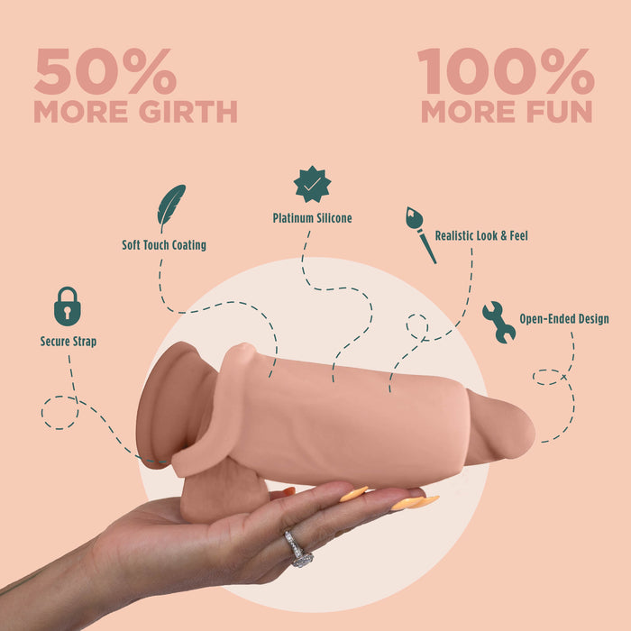 A hand holds the Girthy Pleasure Sleeves - Open-Ended Silicone Penis Sleeve (Size L) showing its secure strap, soft-touch platinum silicone, realistic design, and open-ended tip. Text reads: "50% more girth, 100% more fun.