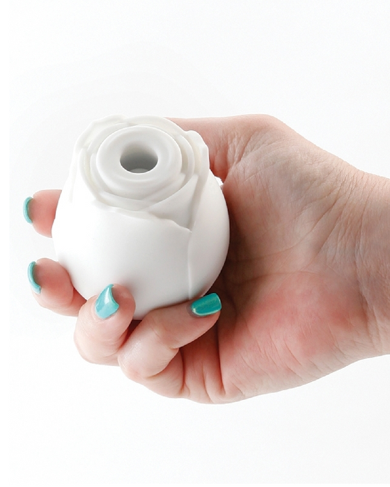 The Rose Powerful Clitoral Air Pulsation Vibrator Glow in the Dark  in model's hand with green nail polish 