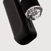 Close-up of The Handy 2 Interactive Automatic Masturbator, sleek and black with a transparent, textured cylindrical attachment featuring bubble-like details, set against a plain white background.