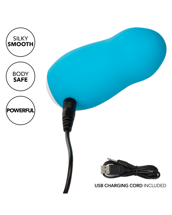 Sugar Dream Palm Sized Clitoral Vibrator with Lid with cord plugged in 