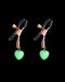  Glow in the Dark Heart Nipple Clamps on black background 