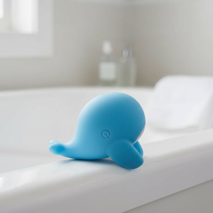 The Heavenly Humpback Waterproof Finger Bullet Vibrator features a sleek, rounded blue design with gentle curves and smooth lines, discreetly shaped like a small whale with flippers, shown from the side on a white background.