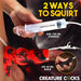 A hand holds a syringe above the Hell Hound Canine Squirting Penis Enhancer, squirting liquid. Text reads "2 ways to squirt: use 100 ml syringe or 30 ml bulb." Another hand squeezes a black bulb. Logo at bottom.