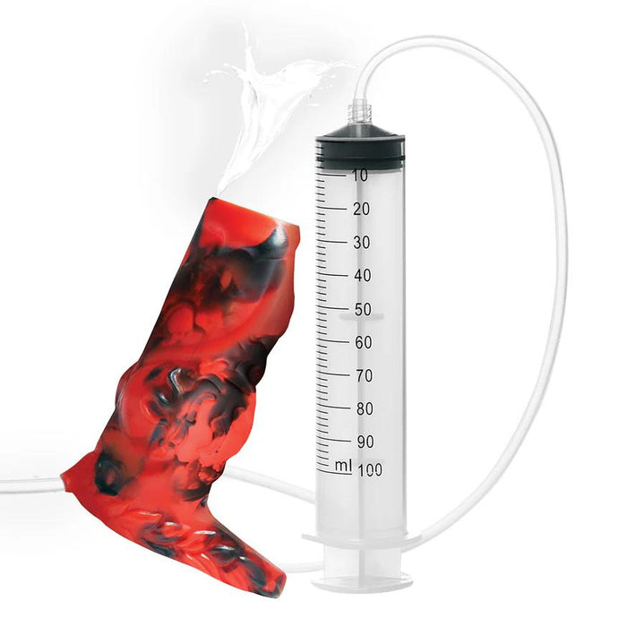 The Hell Hound Canine Squirting Penis Enhancer features a large syringe connected by a tube to a red and black marbled sleeve, allowing liquid to spray from the tip of this fantasy sex toy.