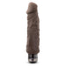 The Home Wrecker 9.5 Inch Vibrating Dildo - Chocolate features brown silicone, a veined texture, rounded tip, and metallic base. This large, waterproof dildo offers lifelike pleasure with powerful vibrations for a realistic experience.