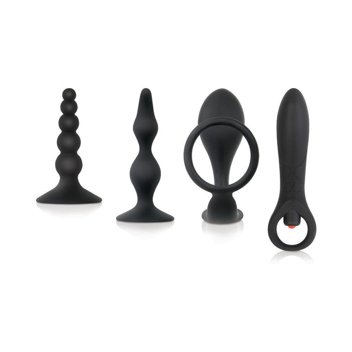The Intro To Prostate Kit 4 Piece Silicone features four black silicone anal toys in various shapes and sizes, lined up side by side on a white background, each crafted for unique sensations and beginner-friendly prostate stimulation.