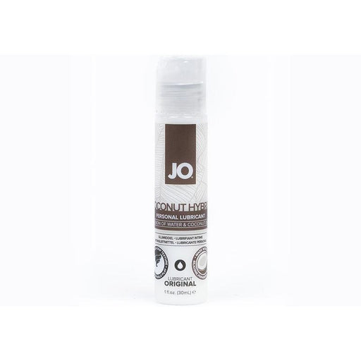 A bottle of System Jo JO Coconut Hybrid Original Lubricant is displayed against a white background. The cylindrical bottle features a white label with brown and gray accents, indicating the product inside is a paraben-free, water-based coconut hybrid lubricant in a 1 fl. oz. (30 ml) size.