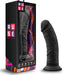 The Jammy Silicone Thick 8 Inch Black Silicone Dildo stands upright on its sturdy suction cup base next to its vibrant Ruse box, which features bold graphics and highlights the platinum cured silicone material.