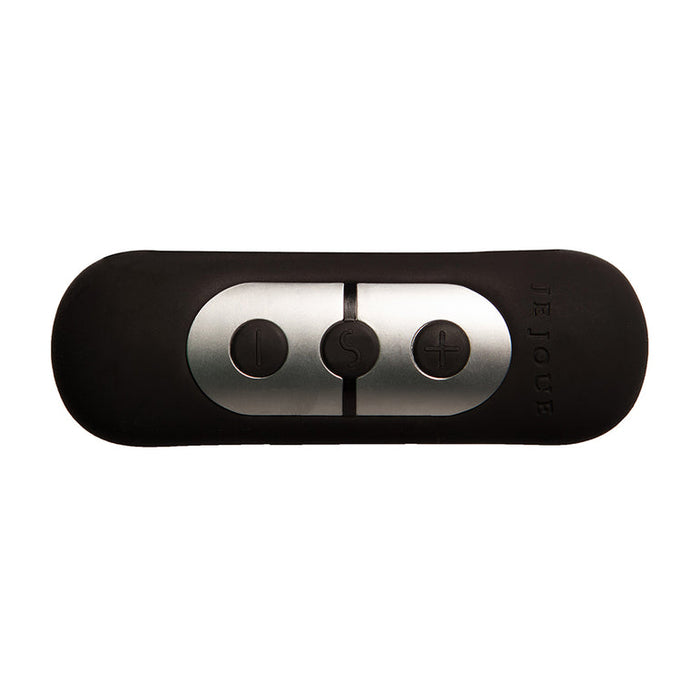 The Je Joue Vesta Petite Powerful Remote Control Vibrating Butt Plug comes with a black and silver silicone remote featuring three buttons (minus, power, plus) and "Je Joue" embossed on the right side.
