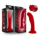 The Jezebel Sleek Curved 6 Inch Red Silicone G-Spot Dildo, featuring a flared, harness-compatible suction cup base, is shown beside its branded packaging. An inset highlights a close-up of the secure suction base.