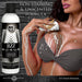 A woman in a gray bra applies a creamy lube to her chest using Jizz Ultra Realistic Unscented Cum Lube. The bottle is on the left, and text says “Non-staining & unscented formula; water-based lubricant for smooth application.”.