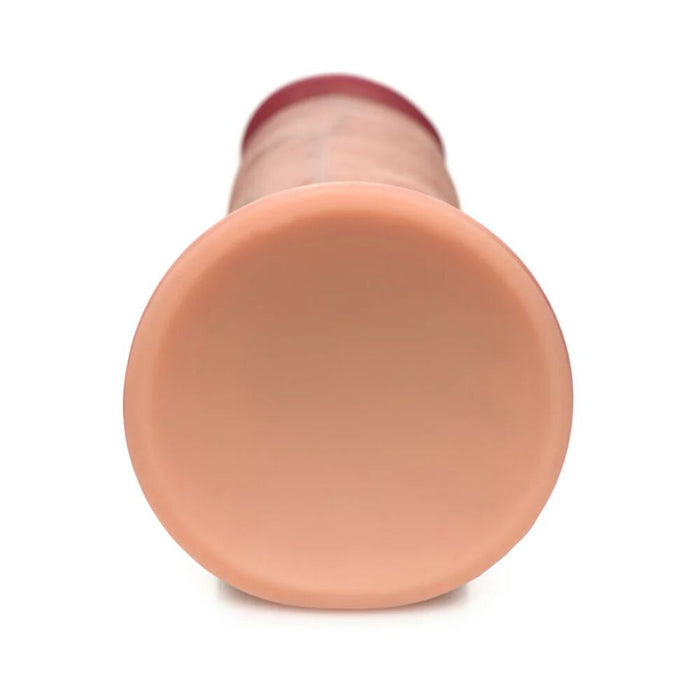 A close-up of the Jock Dual Density Light Tone Silicone Thick 7 Inch Dildo with Suction Cup, featuring a cylindrical shape, smooth rounded tip, subtle ridges, and soft dual density silicone, shown against a white background.