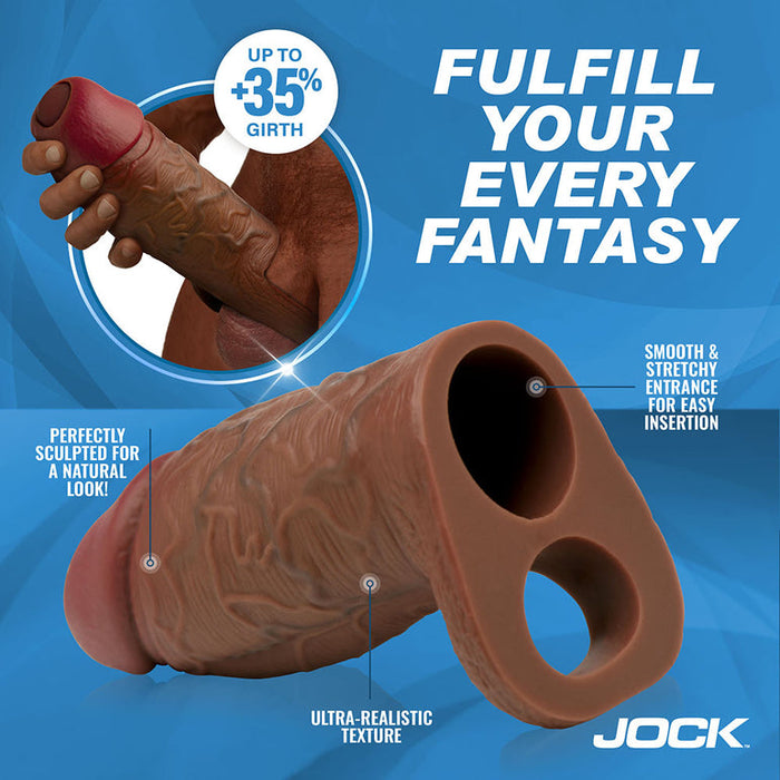 The Jock Girthy Open Ended Silicone Penis Sleeve - Chocolate is shown with labeled features: smooth, stretchy entrance, ball strap, open-ended tip, and lifelike texture. Bold text says "Fulfill your every fantasy," with JOCK branding visible.