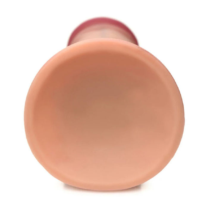 A close-up shows the Jock Lifelike 6 Inch Dual Density Light Tone Silicone Beginner Dildo with Suction Cup - Vanilla, featuring a smooth, flesh-toned tip against a white background. This lifelike dildo is strap-on compatible.