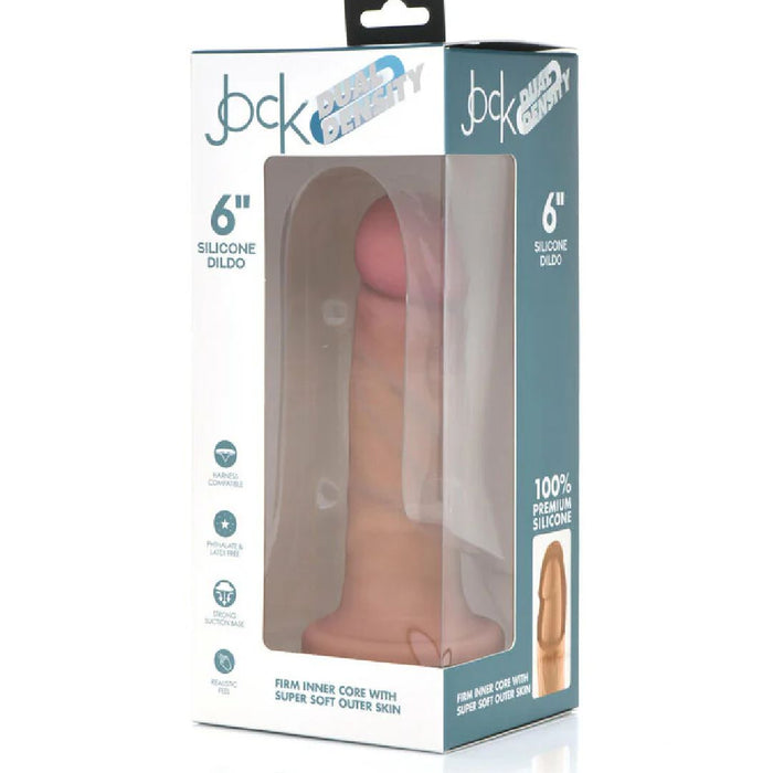 The Jock Lifelike 6 Inch Dual Density Light Tone Silicone Beginner Dildo with Suction Cup - Vanilla is displayed in a box highlighting its realistic feel, strap-on compatibility, and premium silicone, all visible through a clear window.