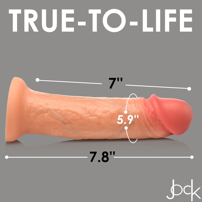 The Jock Real Skin Thick 8 Inch Light Tone Silicone Suction Cup Dildo is displayed horizontally on a gray background, measuring 7" in circumference and 7.8" in length. "TRUE-TO-LIFE" appears above, with a logo at the bottom right.