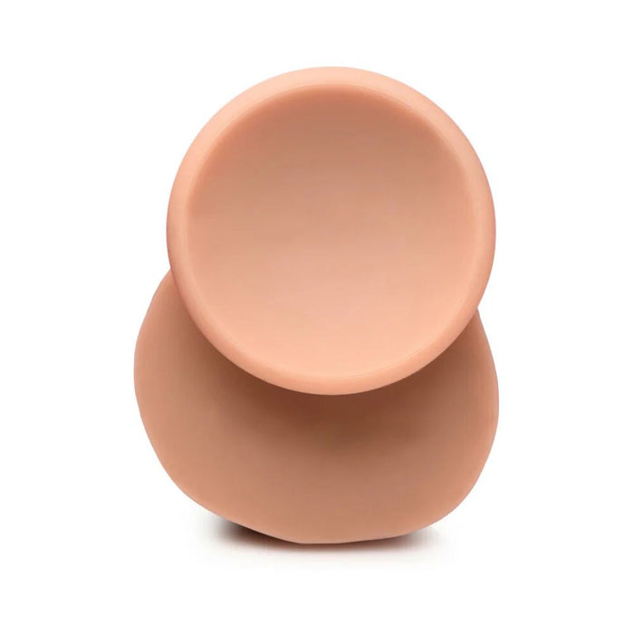 The Jock Realistic Dual Density Huge Silicone 9 Inch Dildo with Balls & Suction Cup, in a smooth flesh tone with a matte finish, stands on its rounded base against a white background.