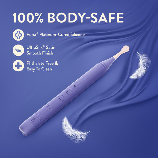 The Juno Precision Tip Oscillating Vibrator with 3 Attachment Heads is shown on a silky purple background with floating white feathers. Text highlights its body-safe Puria silicone, UltraSilk smooth finish, and phthalate-free, easy-to-clean design.