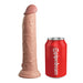 The King Cock Elite Long 9" Vibrating Dual Density Silicone Dildo with Remote, featuring a realistic flesh tone and textured surface, stands upright beside a red "pipedream" soda can for size reference.
