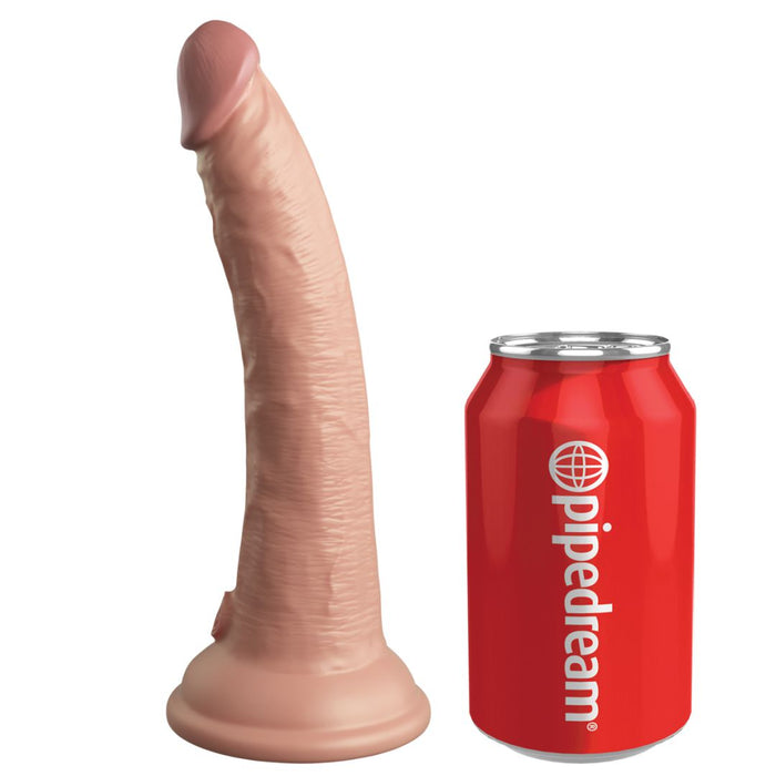 The King Cock Elite Realistic 7 Inch Dual Density Light Tone Silicone Dildo with suction base stands next to a red soda can labeled "pipedream," clearly showing their size difference.
