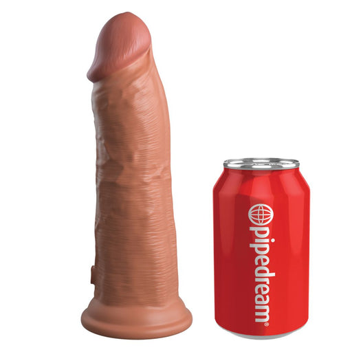 The King Cock Elite Thick 8 Inch Dual Density Medium Tone Silicone Dildo with a suction cup base stands upright beside a red "pipedream" soda can for size comparison.