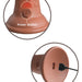 Close-up of the King Cock Elite Thick 8 Inch Vibrating Dual Density Medium Tone Silicone Dildo’s brown electronic control, showing a circular grill-designed power button (labeled in white) and power cord at its base—perfect with your favorite vibrating dildo.