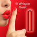 A close-up of a person holding a finger to their red lips, suggesting quietness. To the right, there is a small, red, cylindrical object with a glowing outline—this USB rechargeable Kool Vibes Rechargeable Mini Bullet by Blush. The text "Whisper Quiet" is displayed in white on the red background.